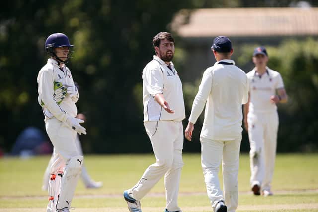 Waterlooville's Nathan White, second left, is congratulated after dismissing Railway Triangle's top scorer Tom Newman. Picture: Chris Moorhouse