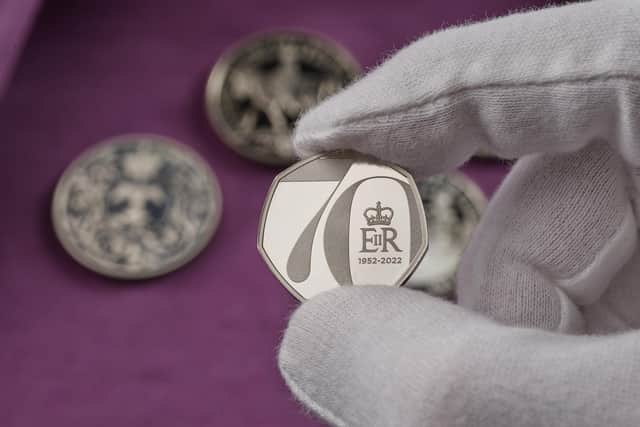 The new 50p coin created to celebrate the Queen's Platinum Jubilee that will be launched next year Picture: Royal Mint/PA
