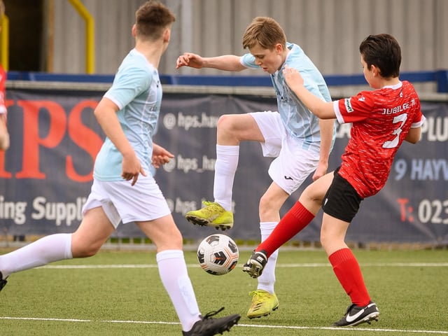 Action from the Portsmouth Youth League Geldard Invitation Cup final between Jubilee 77 U13s and Castle United U13s (light blue and white kit). Picture: Keith Woodland (190321-380)