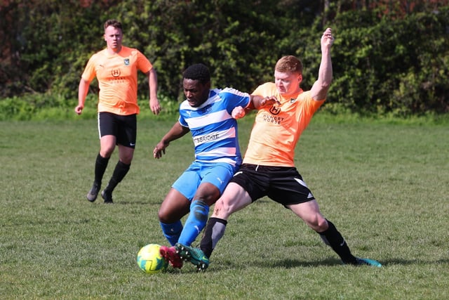 Action from the Buster Gordon Memorial Cup tie between AC Copnor (blue and white kit) and Seagull (orange and black kit). Picture: Sam Stephenson