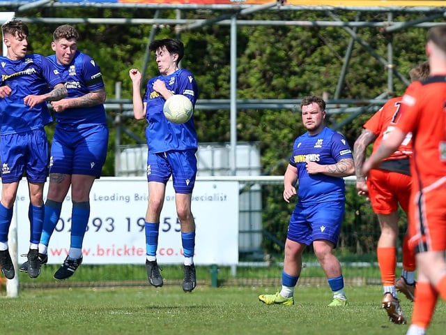 Baffins defend against a Portchester free-kick. Picture: Chris Moorhouse