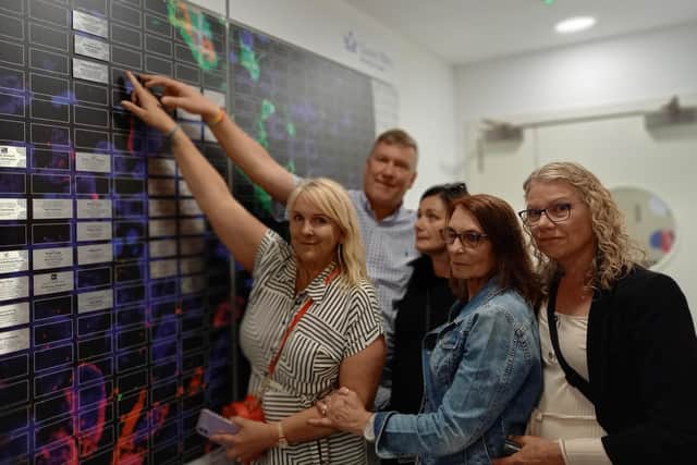 Family members of Graham Green, who died from an aggressive brain tumour, raised enough money to fund three days worth of research into finding a cure for the disease.
Pictured: Sharon, Andrew, Melanie, Vivien and Michelle at the Wall of Hope.