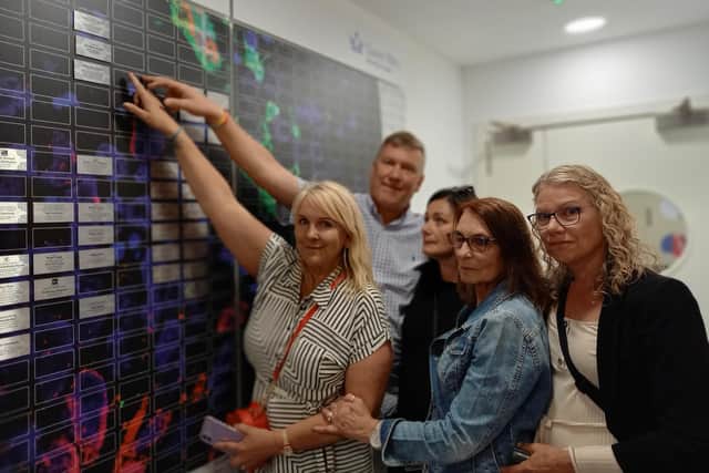 Family members of Graham Green, who died from an aggressive brain tumour, raised enough money to fund three days worth of research into finding a cure for the disease.
Pictured: Sharon, Andrew, Melanie, Vivien and Michelle at the Wall of Hope.