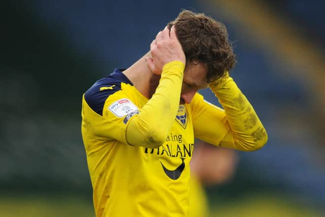 Oxford United will appeal Matty Taylor's red card picked up against Peterborough ahead of their trip to Pompey in midweek.