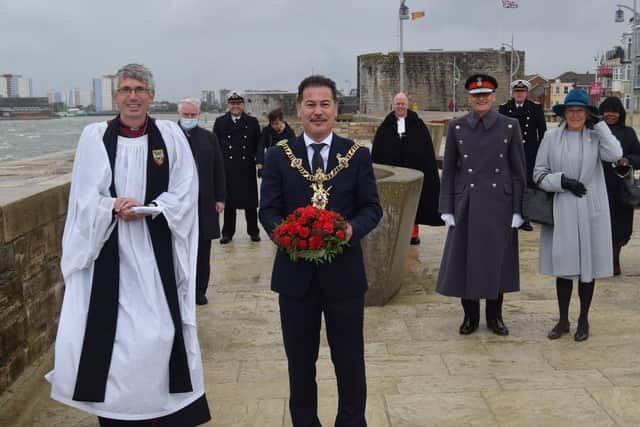 Lord Mayor of Portsmouth Councillor Rob Wood, with the wreath, pictured next to the Very Revd Dr Anthony Cane, Dean of Portsmouth and dignitaries behind. Photo: Tom Cotterill