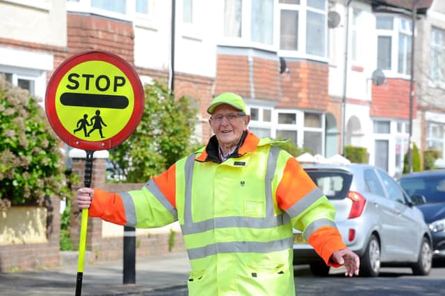 Dennis Hogger, 83, has been helping children cross the road in Hilsea for 20 years. Picture: Sarah Standing (240423-6895)
