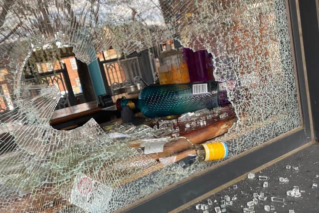 The smashed front window of The Wicks Bar & Grill in Fareham.