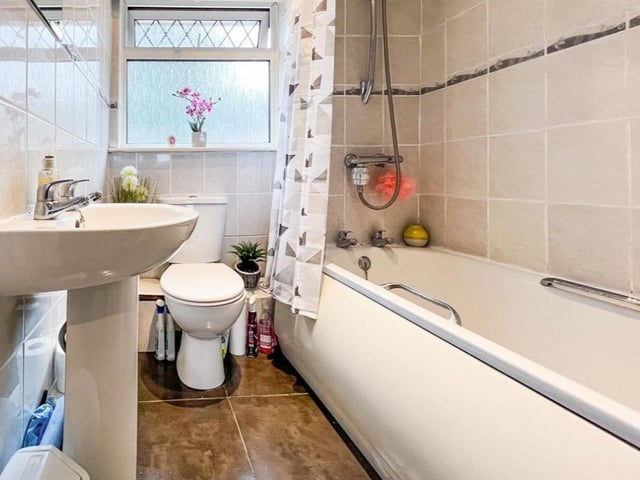 This two bedroom house in Cosham has a spacious bathroom which has a shower over bath.