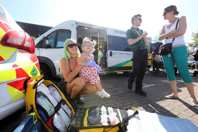 The 2019 Port Solent 999 Day: Scarlett, two, tries on paramedic gloves with her mother, Jasmin Garrett. Picture: Chris Moorhouse     (140919-08)