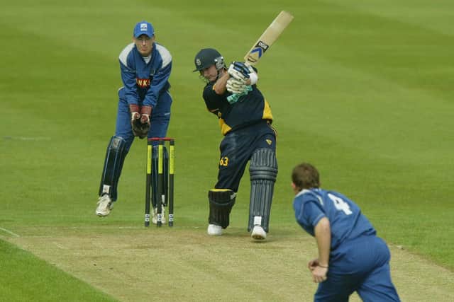 Michael Clarke hits a boundary during a National League match at Edgbaston in April 2004. PA Photo: David Davies.