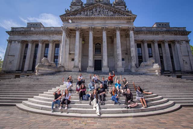 Some of those who have found roles through the 100 in 100 campaign, on the steps at Portsmouth Guildhall