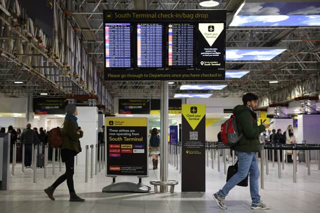 Information board at Gatwick Airport. (Photo by Hollie Adams/Getty Images)