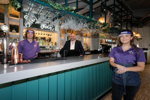 From left, Warren Bone, manager Dan Swan and Justyna Bednarek. Eden at Gunwharf Quays reopened on 'Super Saturday' following the easing of Covid-19 restrictionsPicture: Chris Moorhouse    (040720-10)