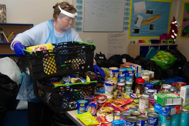 Resident Jan Barnett with the donations at Bidbury Junior School. Picture: Habibur Rahman