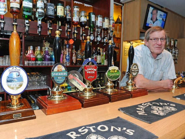 Manager Peter Watson next to some of the real ales the pub had on offer in 2012 (120082-2246)
