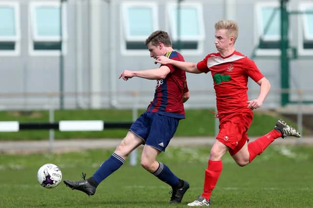 Current Wimborne striker Lewis Beale, left, scores for US Portsmouth against Downton in the Wessex League during his first loan spell in April 2018.
Picture: Chris Moorhouse