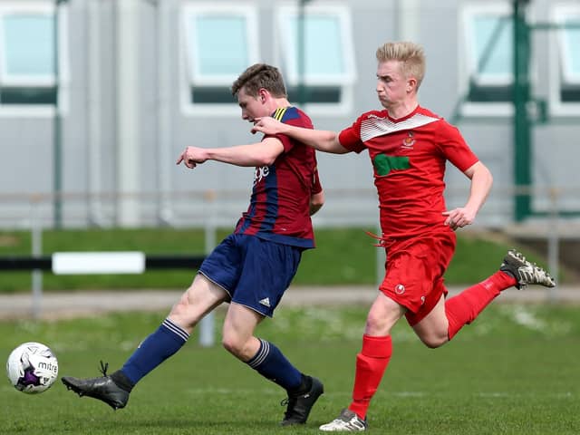 Current Wimborne striker Lewis Beale, left, scores for US Portsmouth against Downton in the Wessex League during his first loan spell in April 2018.
Picture: Chris Moorhouse