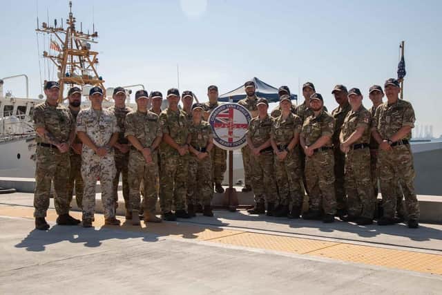 The staff of CTF150 with CO Cdre Byron behind the Peribuoy on the left. The task force has seized at least £161m worth of drugs in the Gulf.