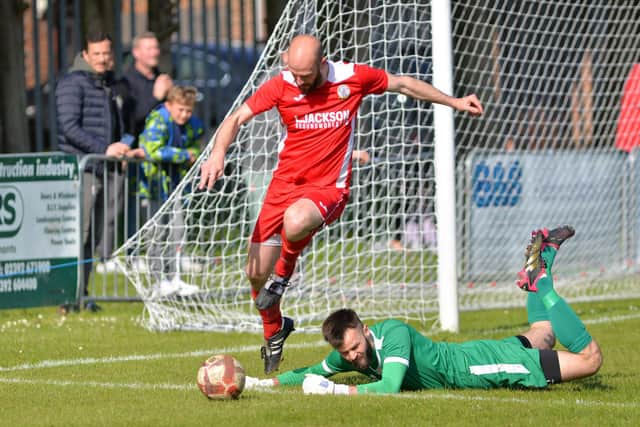 Horndean's Tom Jeffes and Bemerton keeper Patrick Creese. Picture by Martyn White