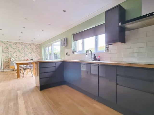The listing says: "A four-bedroom detached family home which is situated in a popular, elevated location yet within easy access of local shopping amenities, bus routes, commutable road links and in the catchment area for both Court Lane and Springfield School."
