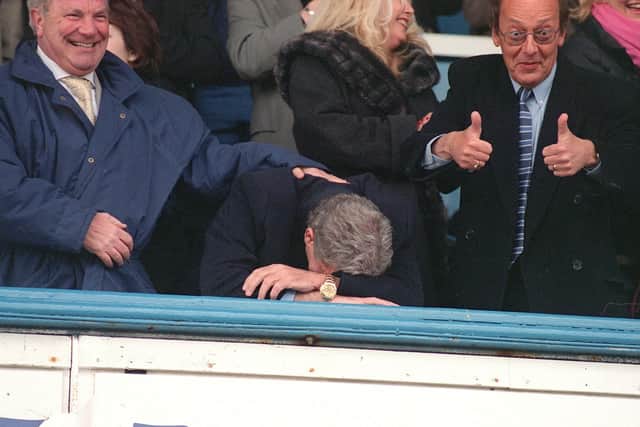 Fred Dinenage delivers the thumbs up and Milan Mandaric is emotional following Pompey's survival from relegation in May 2001. Picture: Malcolm Wells