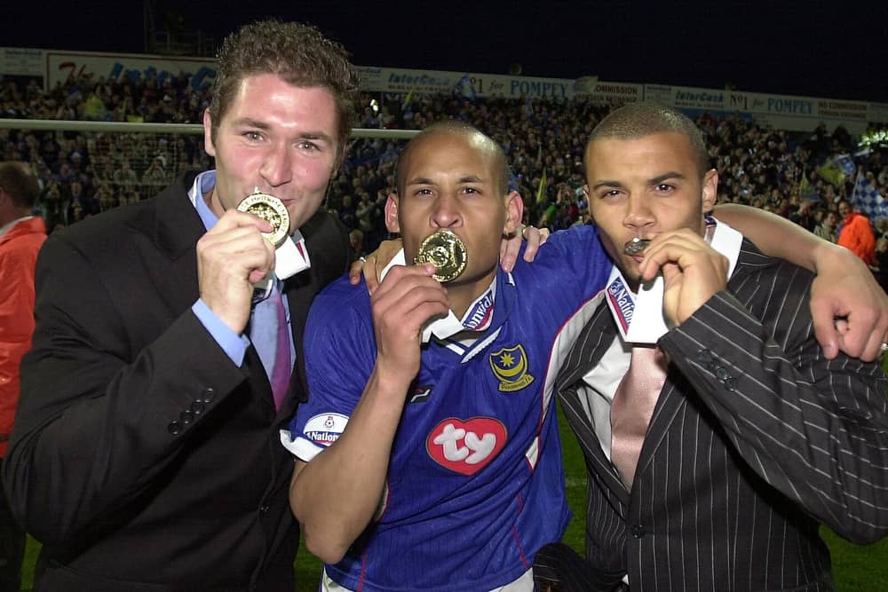 Nigel Quashie, centre, celebrates Pompey's Division One title triumph. Picture: Steve Reid