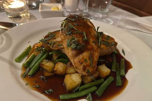 Roasted chicken breast with parmentier potatoes, green beans, mange tout and a red wine and tarragon sauce