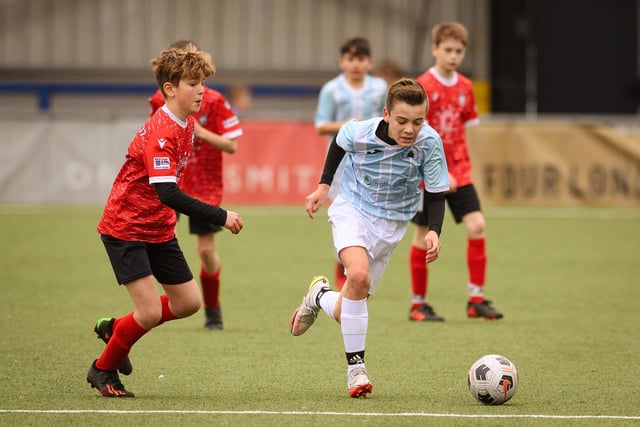Action from the Portsmouth Youth League Geldard Invitation Cup final between Jubilee 77 U13s and Castle United U13s (light blue and white kit). Picture: Keith Woodland (190321-894)