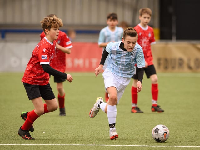 Action from the Portsmouth Youth League Geldard Invitation Cup final between Jubilee 77 U13s and Castle United U13s (light blue and white kit). Picture: Keith Woodland (190321-894)