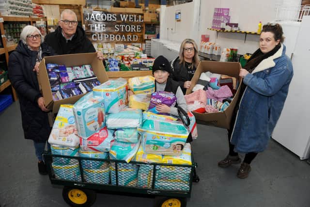 In less than 24 hours, the charity has received a number of donations from Gosport residents.
Pictured is: (l-r) Angela Pottinger (70), Stuart Pottinger (73), Rogan Morrill (12), Lorraine Pottinger (51), manager, and Cherish-Star Pottinger (30) with just some of the donations they have received. Picture: Sarah Standing (280222-9850).