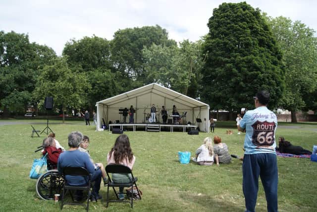Crowds at St. Mary's Church attending the Miltoncross Academy Strawberry Tea Festival.