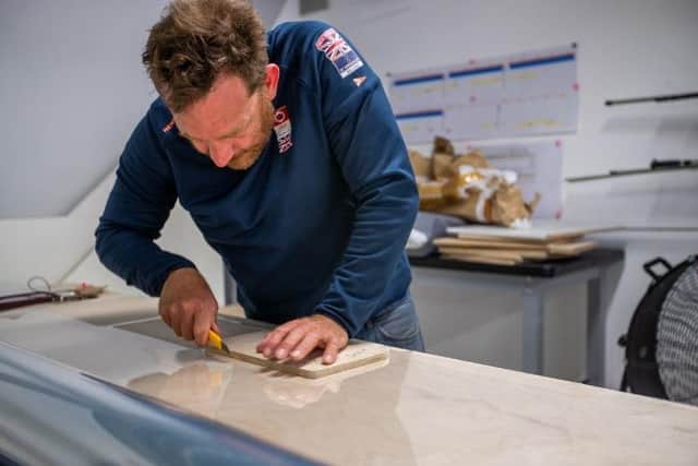 A Team Ineos UK engineer works on producing protective face shields for NHS staff.