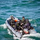 A team of divers and engineers from minehunter HMS Middleton rush to the aid of a stricken fishing boat in the Solent. Photo: Royal Navy