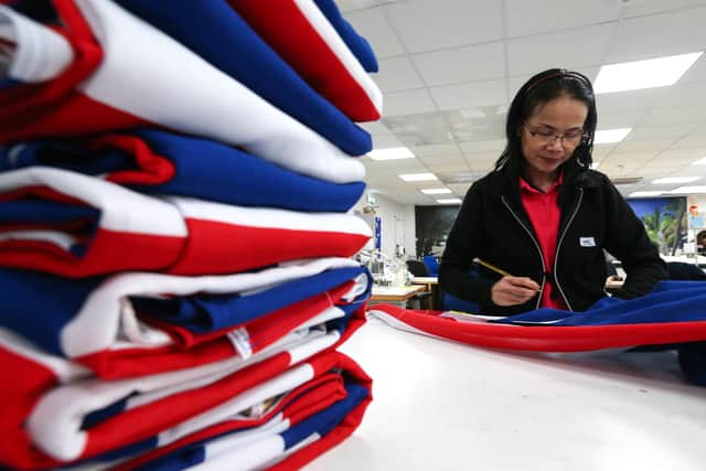 Jai Hyde at work in the machine room on Union flags. Hampshire Flag Company, Waterlooville, is busy making flags and bunting for King Charles' coronation
Picture: Chris Moorhouse (jpns 130423-46)