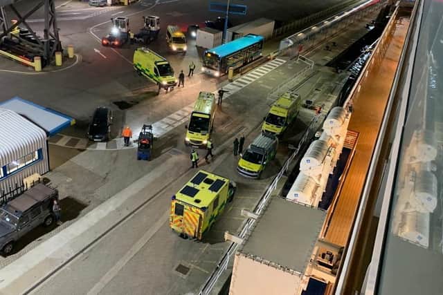 Ambulances attend Portsmouth International Port after Saga's Spirit of Discovery docks on November 6.