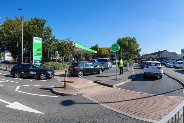 Long queues at Asda petrol station in Fratton. Picture: Mike Cooter (240921)