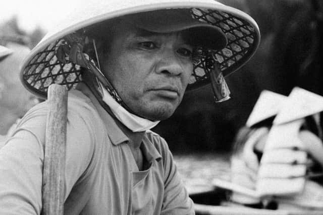 A banana boat man poses whilst taking a break