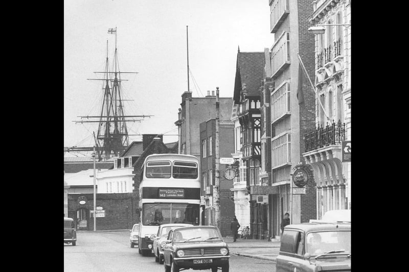 The masts of HMS Victory can be seen behind the vehicles driving at The Hard, Portsea on April 12 1975. The News PP3502