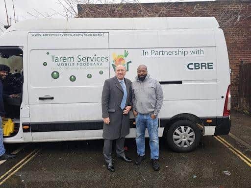 Cllr Paul Whittle with Tarem Services Managing Director Titus Komolafe.