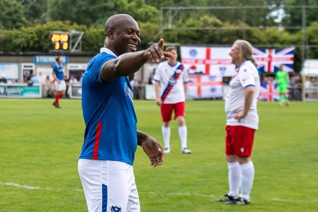 Yakubu points to the Pompey fans after he scored the Blues' fourth.