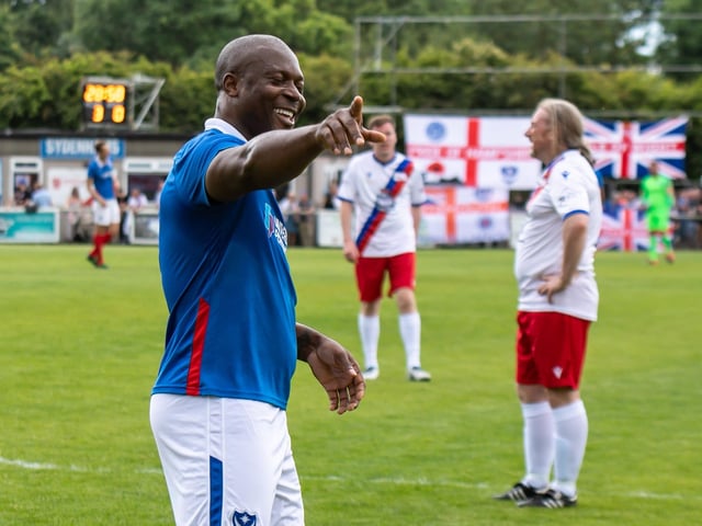 Yakubu points to the Pompey fans after he scored the Blues' fourth.