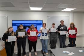 GCSE Maths students with their competition certificates.