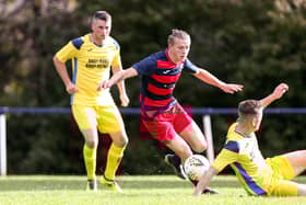 Zak Willett, middle, in action for Paulsgrove. Picture: Chris Moorhouse