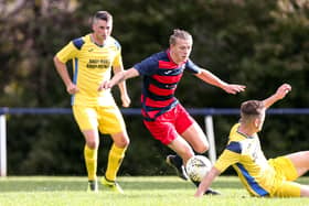 Zak Willett, middle, in action for Paulsgrove. Picture: Chris Moorhouse