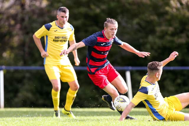 Zak Willett, middle, in action for Paulsgrove. Picture: Chris Moorhouse