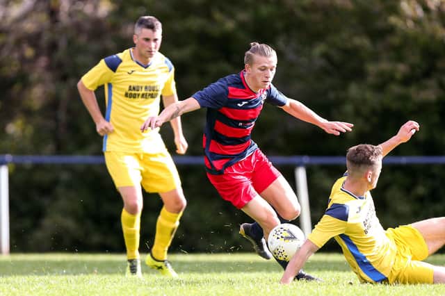 Zak Willett, middle, in action for Paulsgrove. Picture: Chris Moorhouse