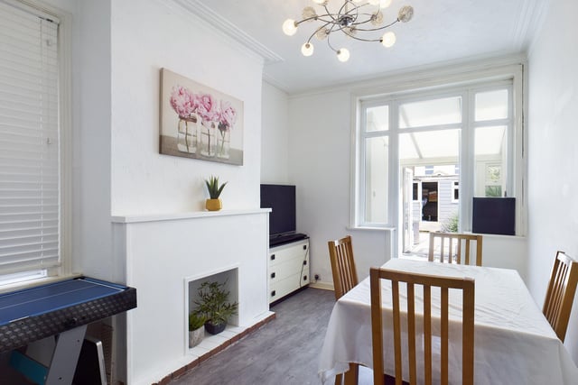 The rear reception space is perfect for a dining room, and also has the original coving