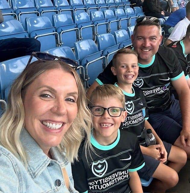 Stuart (right) with his wife Aileen and two of his four children, Keane and Arran.