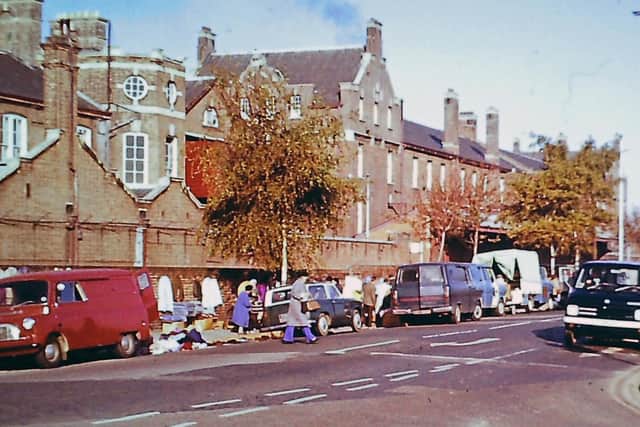 Known as the 'totters’ market’ this was the scene on a Friday morning pre-April 1976. Behind the wall was the dockyard branch railway.