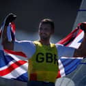 Giles Scott of Team Great Britain celebrates on the podium for the Men's Finn class on day eleven of the Tokyo 2020 Olympic Games. Photo by Clive Mason/Getty Images